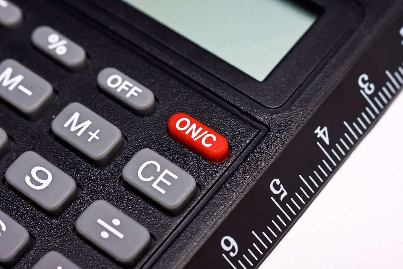 Close-up of calculator buttons and a ruler