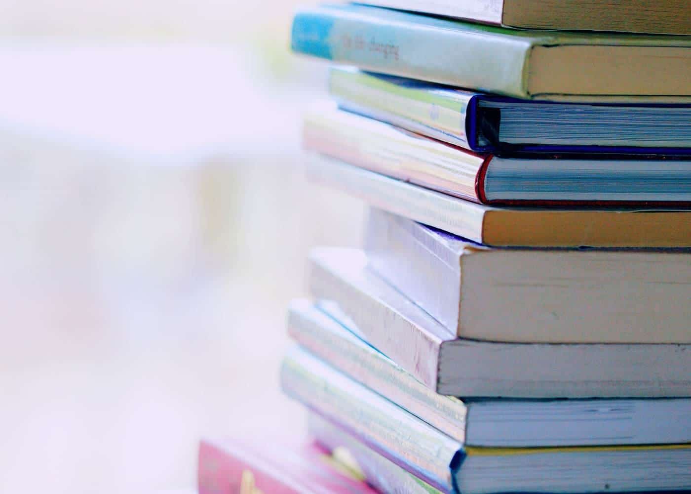 A stack of colourful books on a table